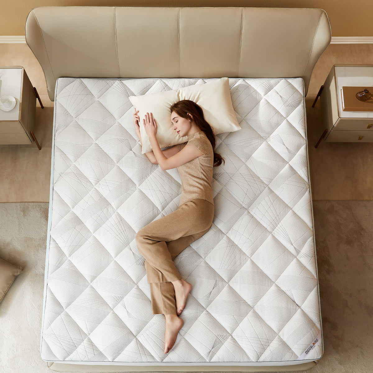 a woman is lying on the soft bamboo gel memory foam mattress topper